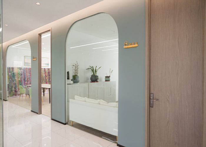 Modern interior with mirrors reflecting a living room and dining area.