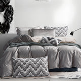 Elegantes 7-teiliges Bettwäscheset in Silber und Grau mit geometrischen Zierkissen und strukturiertem Stoff