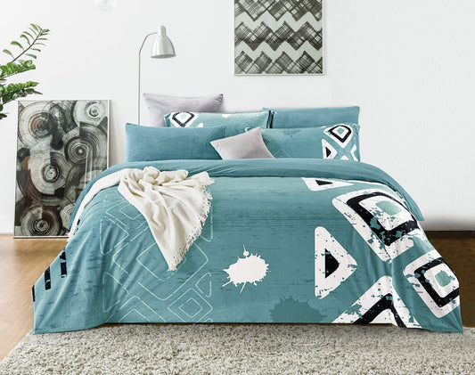 A king-sized fleece comforter set with a geometric graffiti print, displayed in a bedroom setting with two contrast pillowcases, a duvet cover, and a blanket.