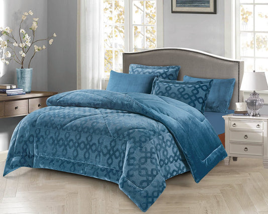A navy grid quilted comforter set on a king-sized bed, with accompanying pillow shams, presented in a bright room setting.