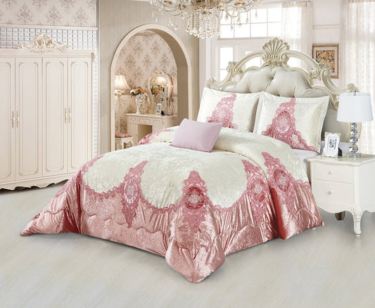 A blush pink and white queen-sized comforter set with floral embroidery displayed on a bed in a luxurious bedroom setting, including a decorative pillow and a duvet cover.