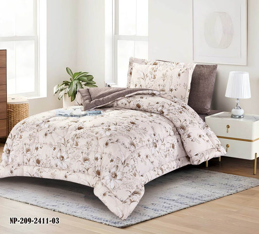 A queen-sized bedding set with floral embroidery, displayed on a bed in a bedroom setting, including a comforter, two pillowcases, and a bedsheet.
