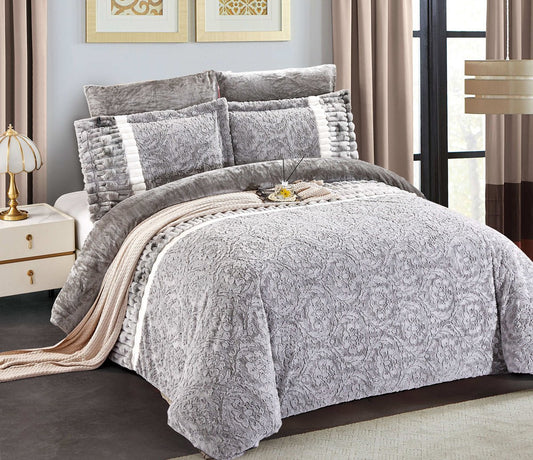 A grey floral rabbit fur bedding set on a king-sized bed, with a comforter, pillow shams, and a bed skirt, in a room setting with elegant decor.