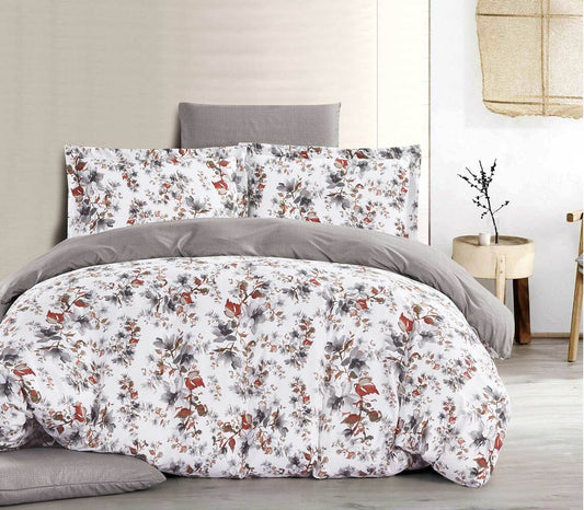 A bedding set with a floral design, featuring a mix of brown, white, and green colors, displayed in a bedroom setting.