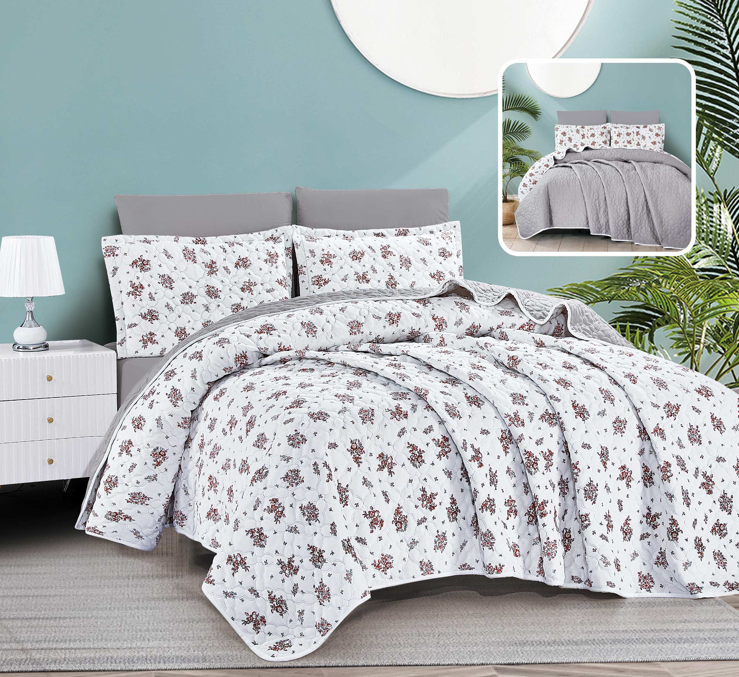 Floral bedding set on a bed with a nightstand and lamp in a room setting.