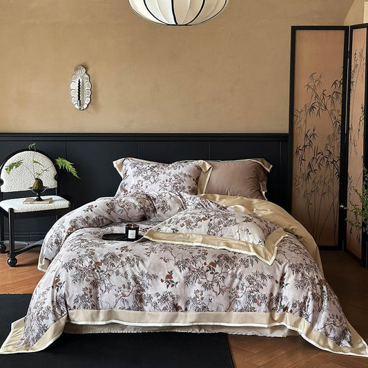 A vintage print Tencel duvet cover set displayed on a bed, with a floral design in a muted color palette.