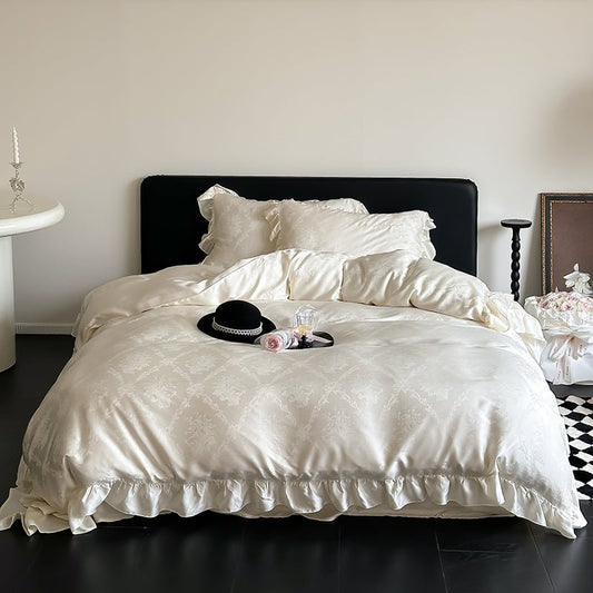 A beige Tencel jacquard duvet cover set on a bed, with decorative pillows and a hat placed on top.