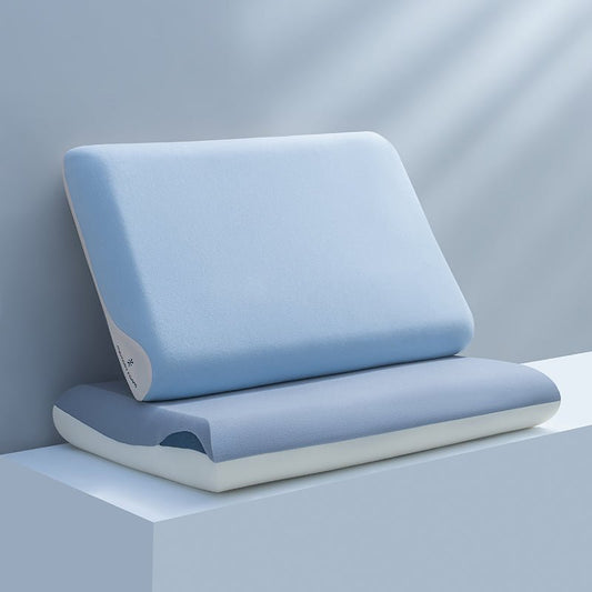 A blue memory foam pillow displayed on a white surface with a shadow cast across its surface.