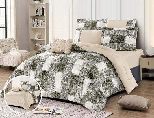 A reversible quilt set with a floral pattern on one side and a solid color on the other, displayed on a bed with accessories such as pillows and a remote control.