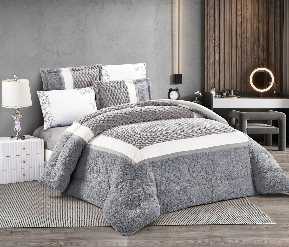 A color block thermal comforter set with a 3D quilted design, displayed on a bed in a bedroom setting. The set includes a grey and white comforter, two pillowcases, and a fitted sheet.