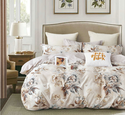 Floral bedding set on a bed in a bedroom with decor elements.