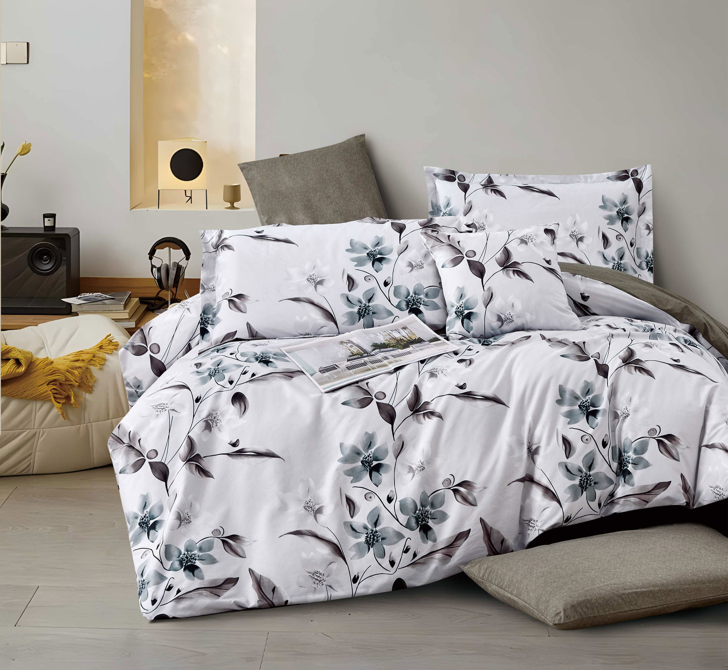 Floral patterned bedding set on a bed in a bedroom setting.