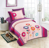 A bedding set with a floral design, featuring a combination of pink, purple, and multicolored flowers on a pink background, displayed in a bedroom setting with a pillow, bedsheet, and comforter.