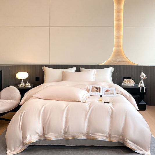 A beige Tencel duvet cover set on a bed, with the duvet partially opened to show the inside. The room has a modern aesthetic with a minimalistic design.