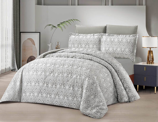 A gray lace comforter set on a bed, with pillowcases displayed against a neutral room background.