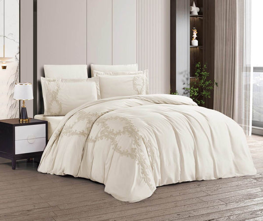 A white minimalist lace bedding set on a bed, with additional pillows and a nightstand in the background.