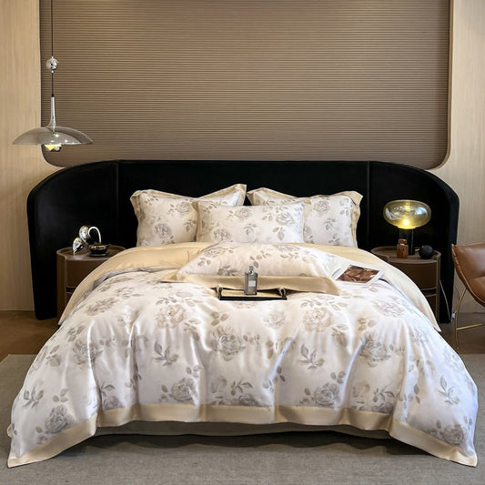 A beige duvet cover set with a floral pattern displayed on a bed in a bedroom setting.