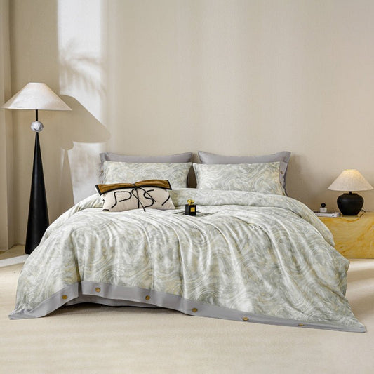 A luxury duvet cover set with a floral pattern, displayed in a bedroom setting with matching pillows and bedsheet.