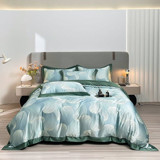 A luxury duvet cover set with a leaf pattern, displayed on a bed in an interior setting.