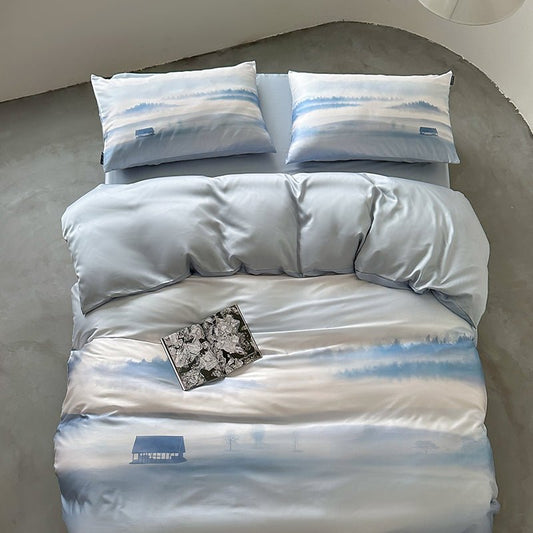 A bedding set with a digital print of clouds and sky, displayed on a bed with a comforter cover and two pillowcases.
