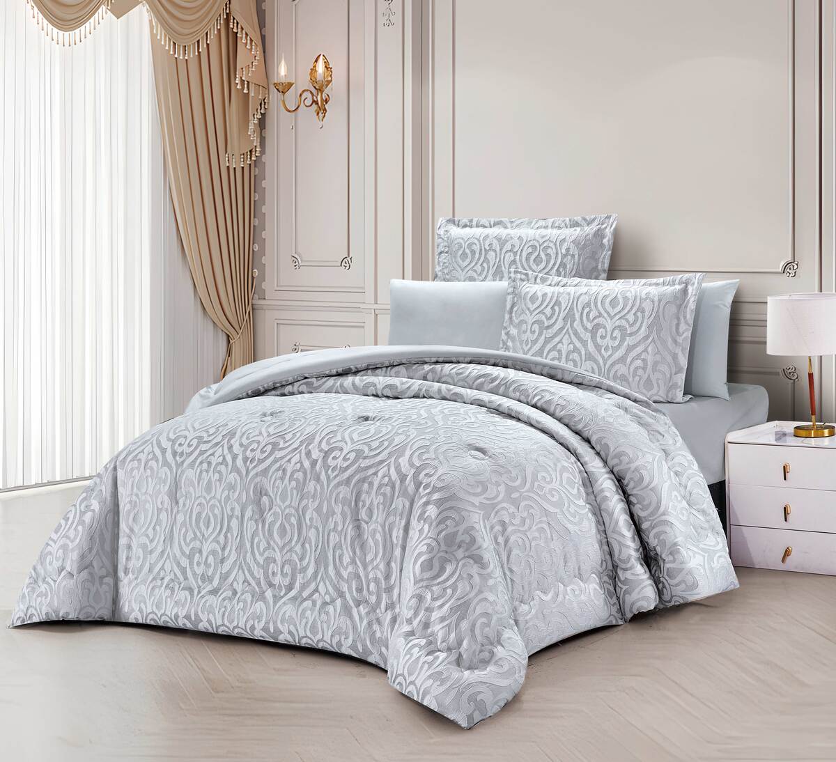 A bedding set with a floral pattern, featuring a comforter, sheets, and pillows, displayed in a bedroom setting.