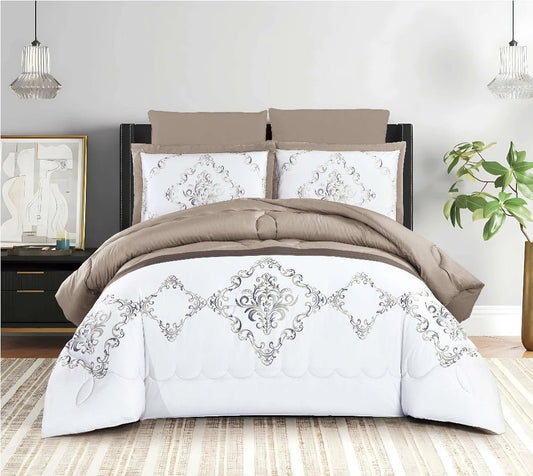A quilted comforter set with a diamond print design, displayed in a bedroom setting. The set includes a comforter in white with gray and brown accents, and matching pillowcases.