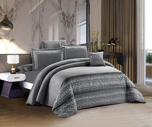 A slate gray lace patchwork bedding set displayed on a bed, with a decorative pattern on the comforter and pillowcases.