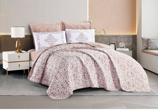 A pink duvet cover with a floral pattern displayed on a bed in a bedroom setting, accompanied by matching pillows and bed sheets.