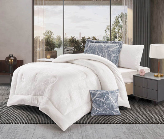 A white leaf-quilted comforter set on a bed, with two pillowcases displayed beside the bed. The bedding appears to have a floral pattern.