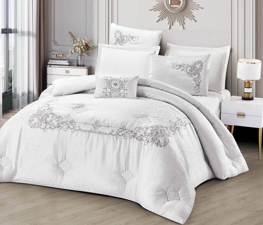 A white bedding set with lace trimmings, displayed on a bed in a room with elegant interior decor.