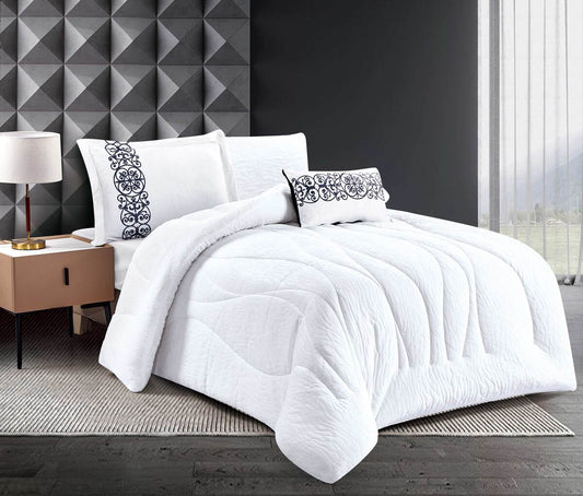 A white quilted comforter set with lace trim displayed on a bed, including a comforter, two pillowcases, and a bed笠, in a room with a modern decor.