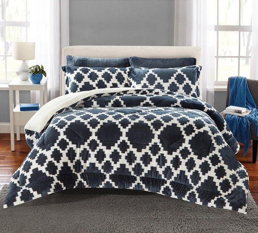 A king-size bedding set with a geometric pattern, displayed in a bedroom setting, including a comforter, two pillowcases, and a bedsheet.