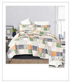 Patchwork quilt set on a bed in a bedroom setting