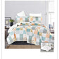 Patchwork quilt set on a bed in a bedroom setting