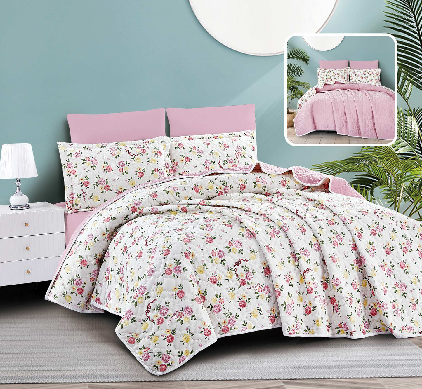 Floral bedding set with pink headboard and matching pillows on a bed.