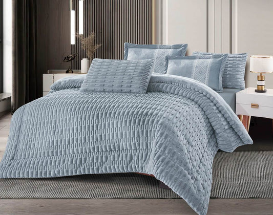A quilted grid flannel comforter set in gray, displayed on a bed with matching pillows and bedsheet.
