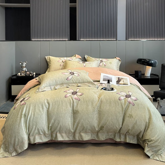 A Tencel printed duvet cover set displayed on a bed, with a floral pattern in green and beige tones.