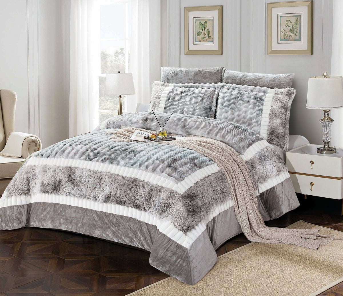 A king-size comforter set with a colorblock flannel design in gray and white, displayed on a bed with additional pillows and a duvet cover.