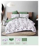 Floral comforter set on a bed with matching pillows in a bedroom setting.