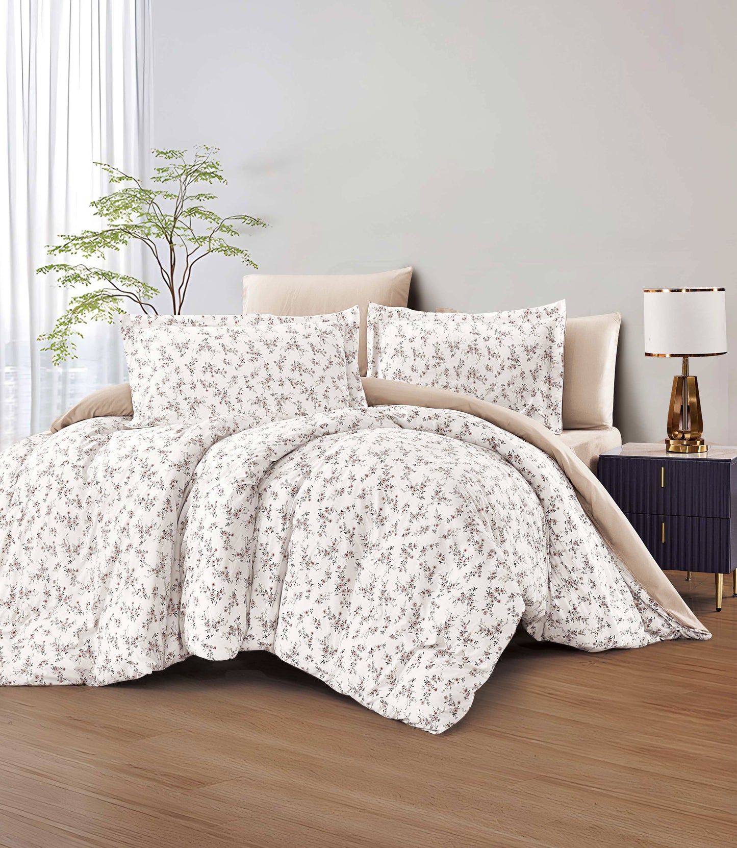 Floral comforter set on a bed in a bedroom with a lamp and plant.