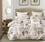 Floral bedding set on a bed in a bedroom with decor elements.