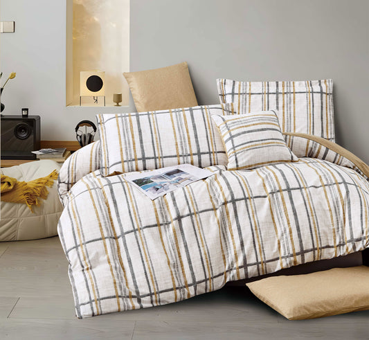 Plaid patterned bedspread on a bed in a bedroom setting