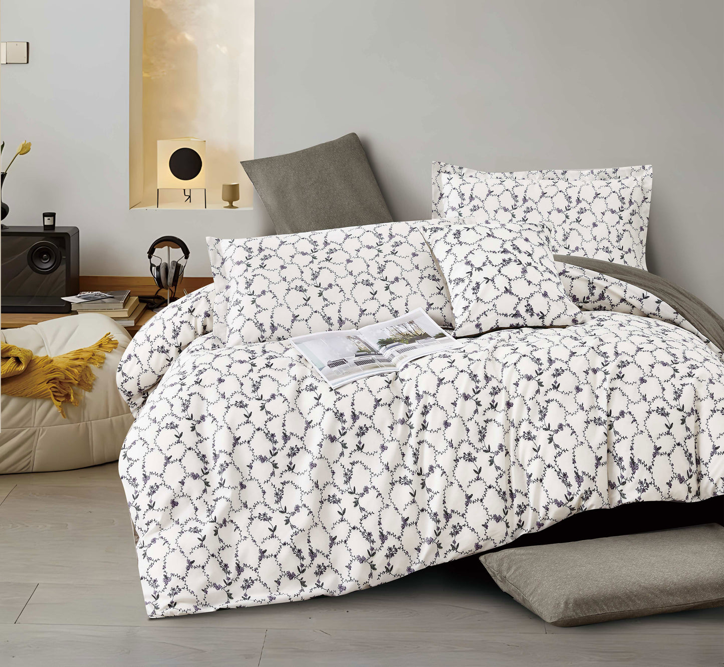 Floral patterned comforter set on a bed in a bedroom setting
