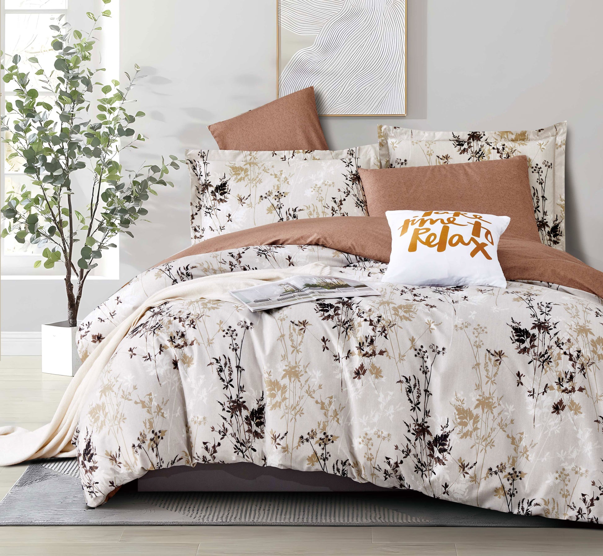 Floral bedding set with brown and beige tones on a bed in a bedroom setting.