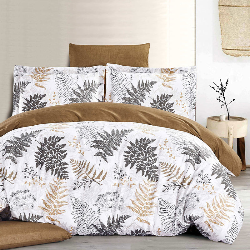 Bedding set with leaf pattern on a bed in a bedroom setting