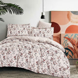 Floral bedding set on a bed with abstract art in the background