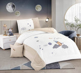A bedding set with a space-themed rocket print, displayed in a bedroom setting with matching pillows and bed sheet.