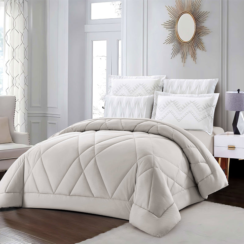 Neatly made bed with white bedding in a bright bedroom